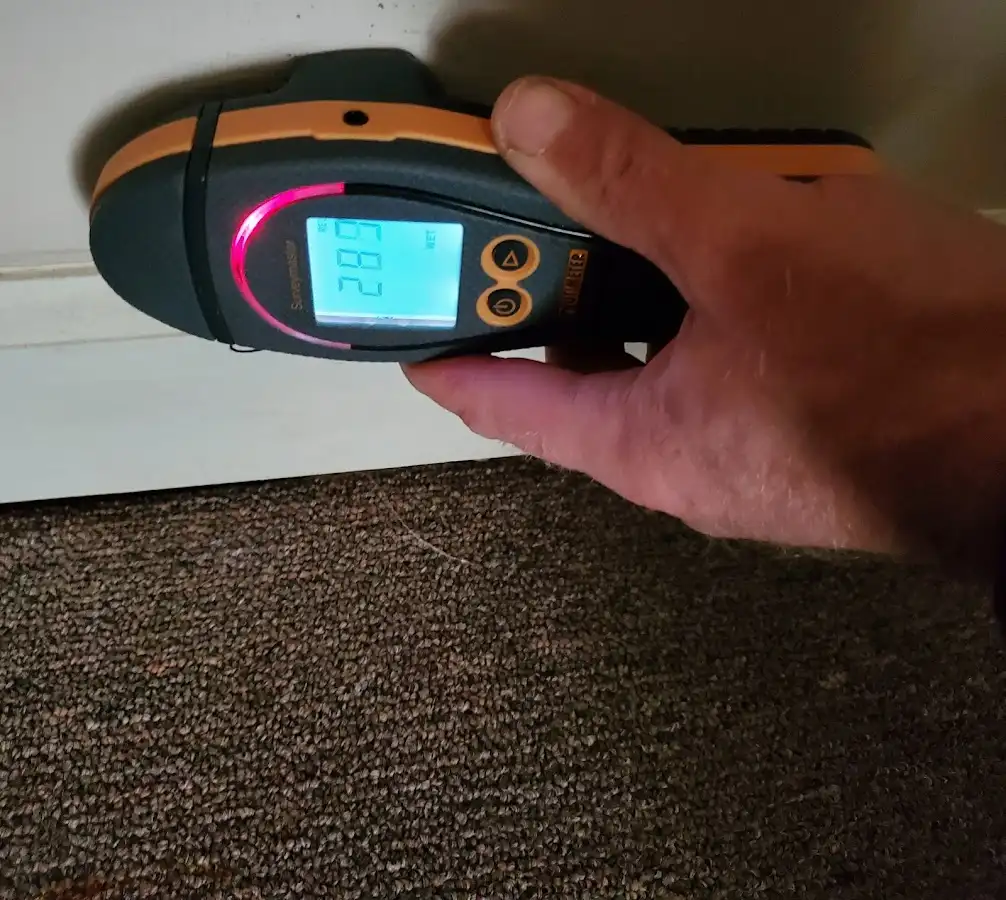 Moisture detection at baseboard during Storm Damage Restoration in Bluffdale